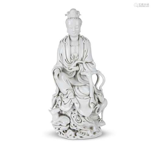 A Chinese blanc de chine figure of Guanyin seated with crane and deer,