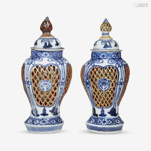 A pair of Japanese porcelain double-walled vases and covers, 18th/19th century