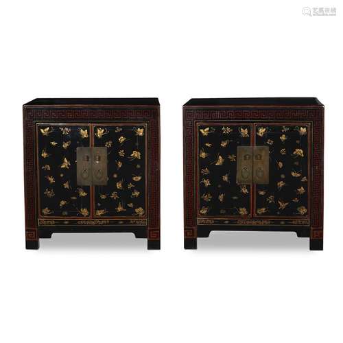 A pair of Chinese black lacquer rectangular small cabinets, decorated with gold butterflies,