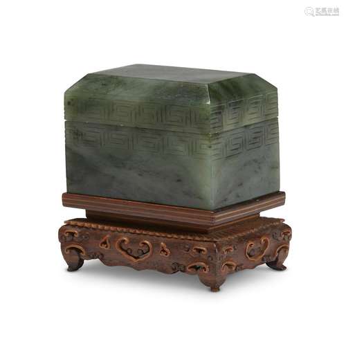 A small Chinese spinach jade box with carved and inlaid wood stand,