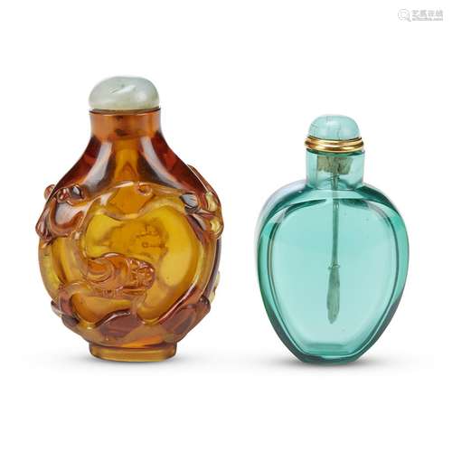 A Chinese amber glass snuff bottle carved with qilong, and a peacock-blue glass snuff bottle,