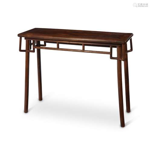 A Chinese huanghuali side table with angled supports,