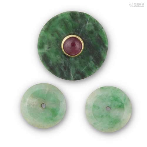 A Chinese mottled dark green jadeite disc mounted with gold and red hardstone and a pair of jadeite disks,