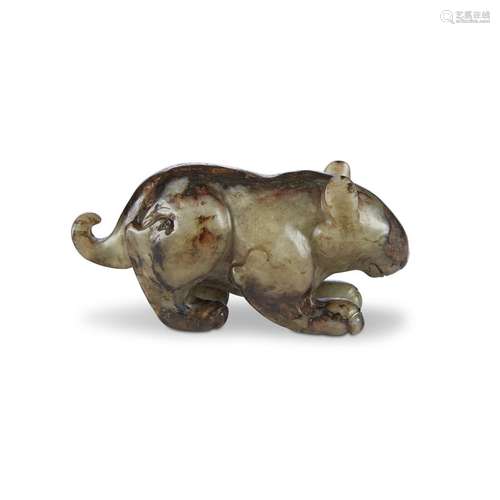 A Chinese carved celadon and brown jade bear, in ming dynasty style