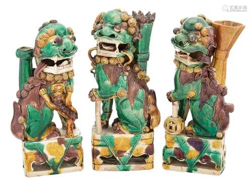Group of Three Chinese Green, Yellow and Aubergine Glazed Taper-Stick Holders