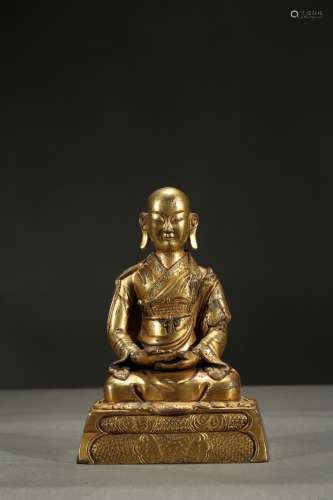 A gilt-bronze figure of arhat