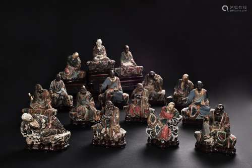 A group of polychrome clay arhat figures