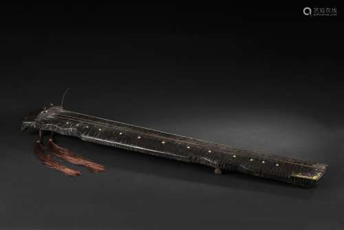 A lacquered wood Guqin with inscriptions