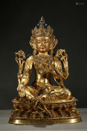 A gilt-bronze and painted figure of green tara