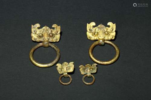 A set of gilt-bronze mythical beast mask fittings