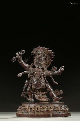 A rare aloeswood carved figure of Mahakala