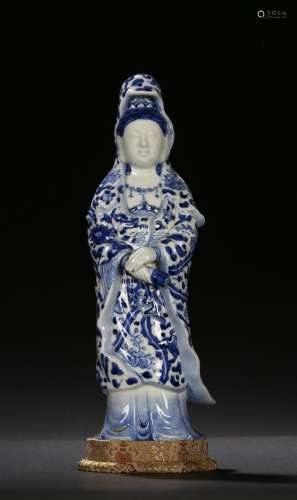A blue and white figure of standing guanyin