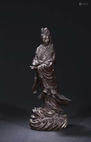A black dry lacquer figure of standing guanyin