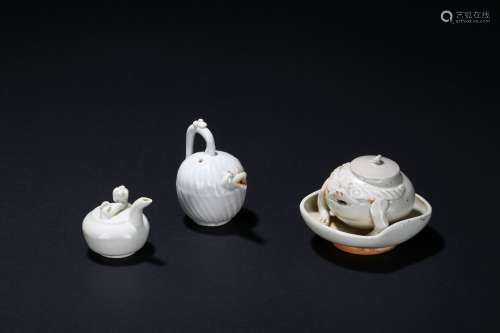 A set of three small white glaze waterpots
