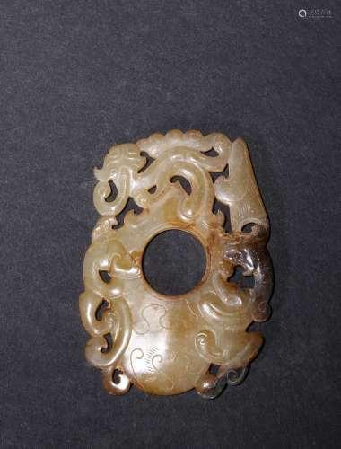 A celadon jade reticulated 'chilong' pendant