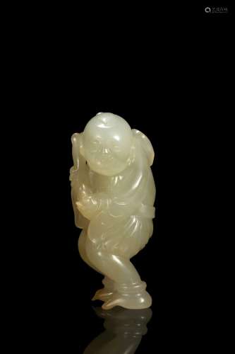 A white jade carving of boy with lingzhi