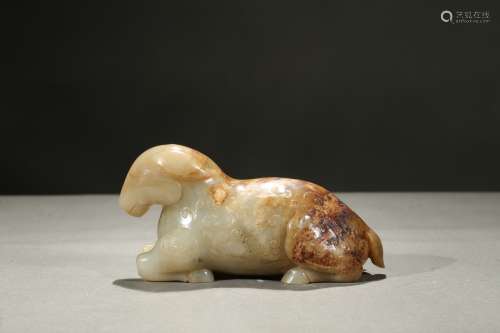 A celadon and russet jade carving of ram