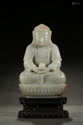 A white jade carved Amitabha on zitan stand