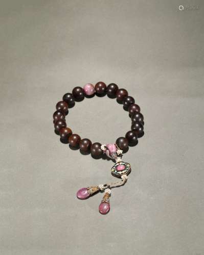 An agarwood and tourmaline rosary bracelet