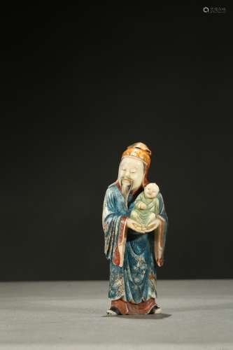 A painted soapstone carving of lu star