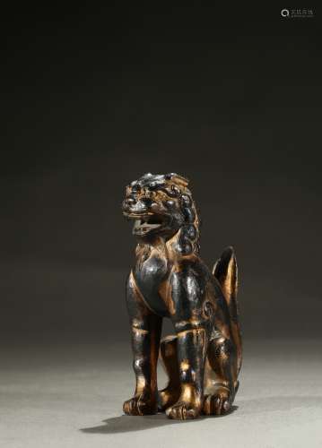 A parcil-gilt bronze cast buddhist lion