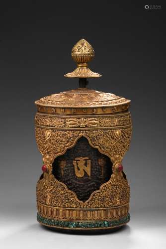 A Tibetan gilt-bronze prayer wheel