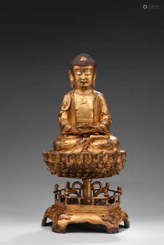 A gilt bronze figure of Amitabha upon stand