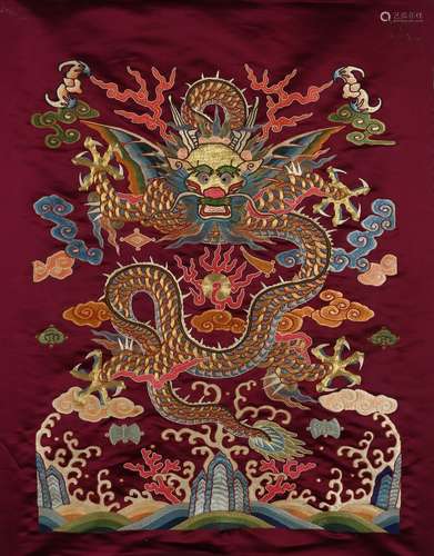 An embroidered silk dragon hanging panel