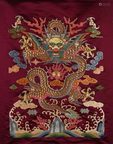 An embroidered silk dragon hanging panel
