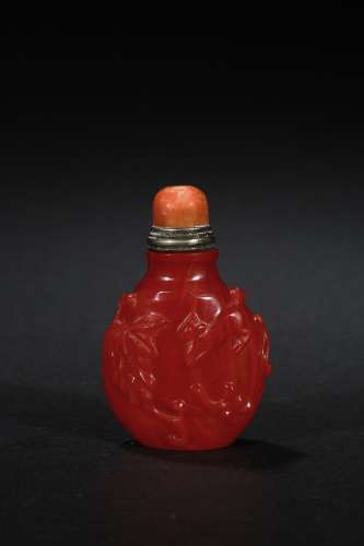 A red glass 'squirrel' snuff bottle