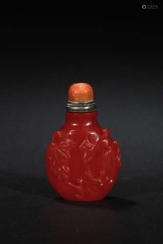 A red glass 'squirrel' snuff bottle