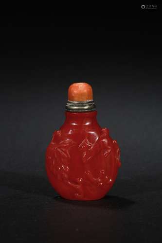 A red glass 'squirrel' snuff bottle