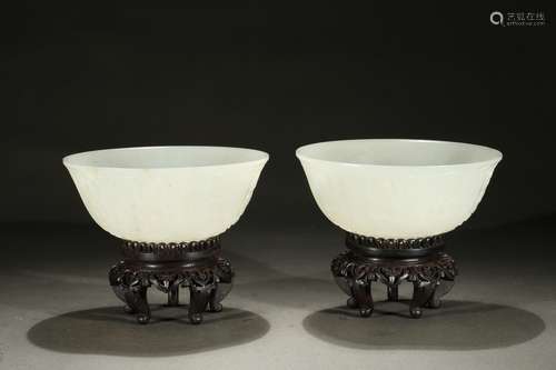 A pair of white jade carved 'Amitabha' bowls