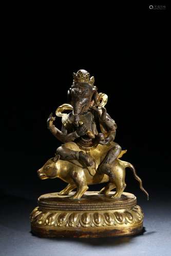 A gilt bronze figure of Ganesha