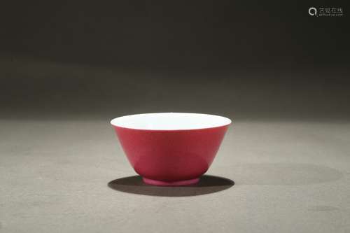 A ruby red glazed wine cup