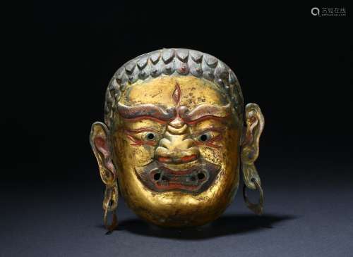 A gilt copper Tibetan repousse deity mask