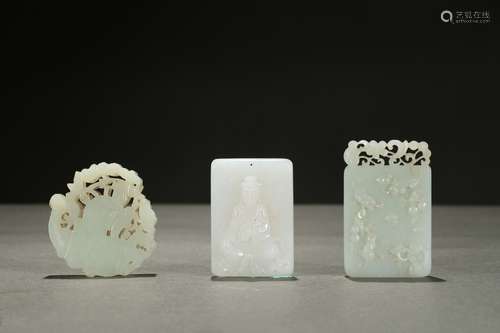 A group of three white jade ornaments