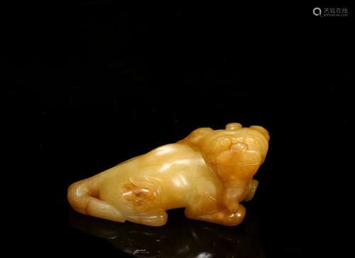 A yellow jade carving of mythical beast