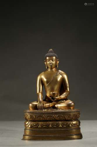 A Mongolian gilt-bronze figure of buddha