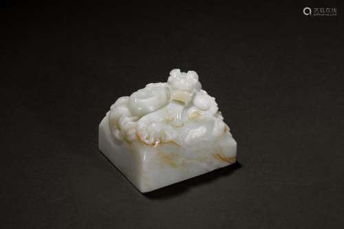 A white jade 'dragon' paper weight