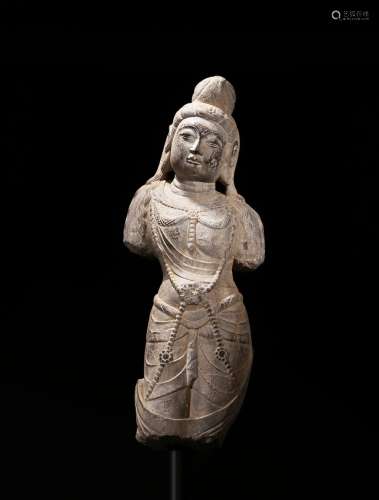 A stone carved sculpture of bodhisattva torso