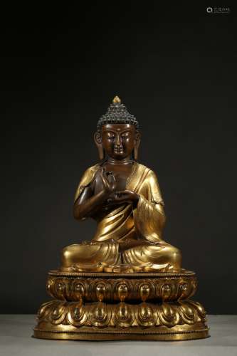 A parcel-gilt figure of buddha