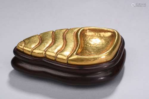 A gilt-bronze palette with stand