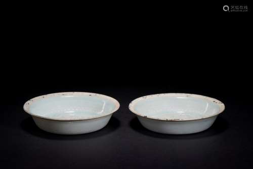 A pair of celadon glazed dishes