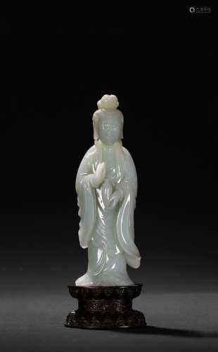 A white jade figure of standing Guanyin