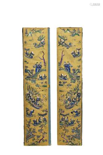 A pair of embroidered 'figures' silk covers