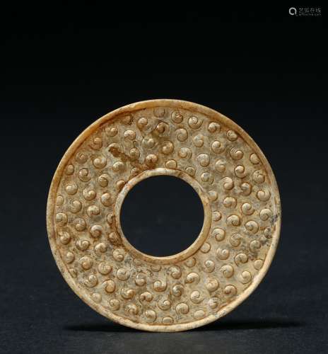 A jade 'spiral' disc bi with calcification