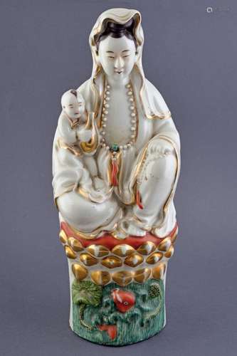 A FINE PORCELAIN FIGURE OF A GUANYING