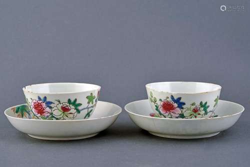 AN ELEGANT PAIR OF PORCELAIN FAMILLE ROSE TEA CUPS AND SAUCERS