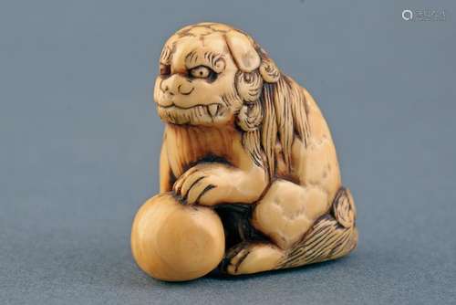 A FINE IVORY NETSUKE PROBABILY SIGNED TOMOCHIKA